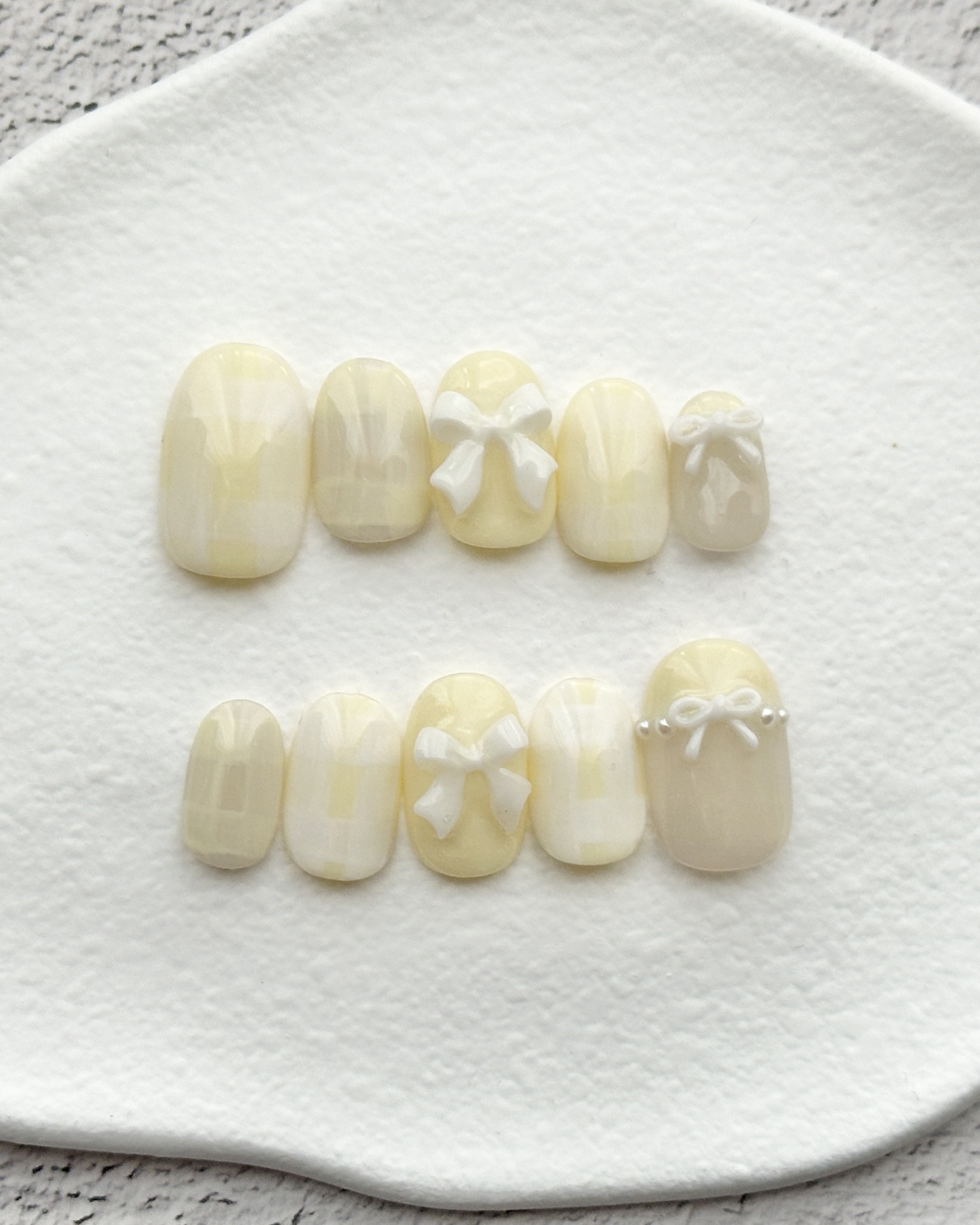 バターカラー リボンネイル｜イエロー ナチュラル ガーリーネイル